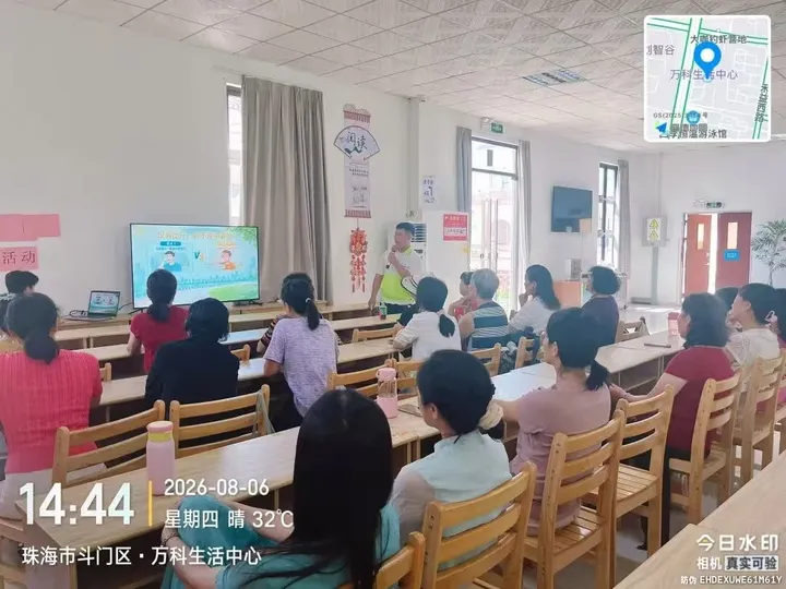 A speaker presenting weather and health information to seated listeners in a community room.