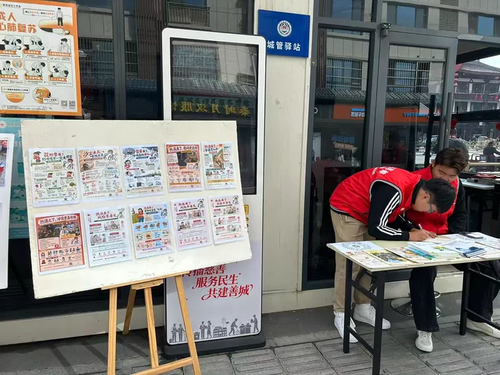 Climate and health materials displayed outside a community service station.